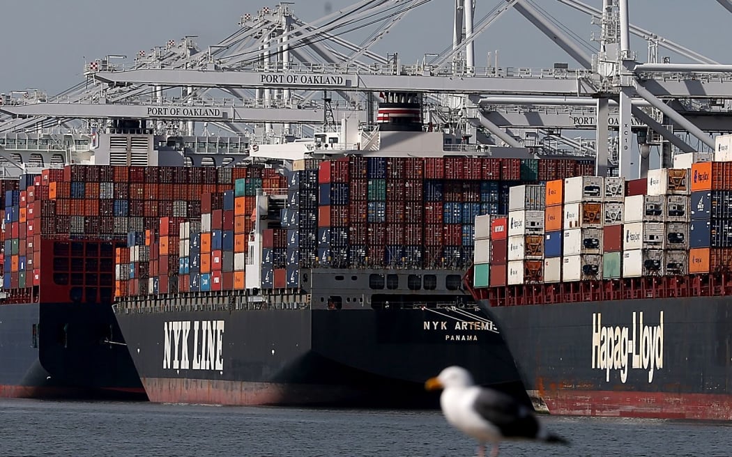 Container ships sit moored at the Port of Oakland. A work slowdown at West Coast ports continues amidst long contract negotiations between Pacific Maritime Association and the International Longshore and Warehouse Union.