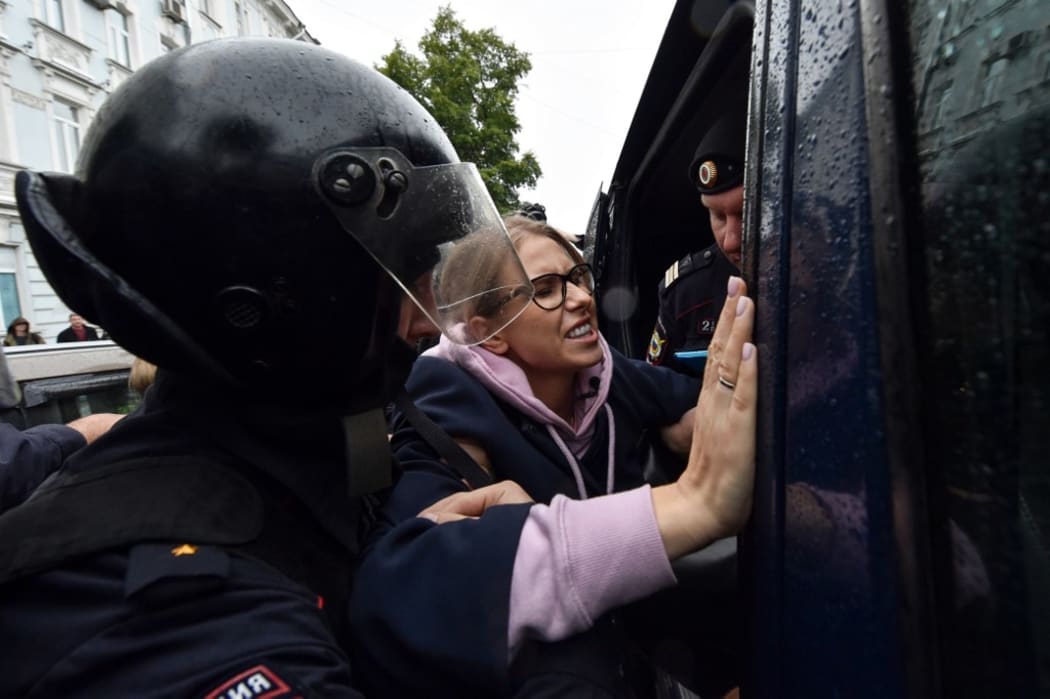 Police officers detain opposition politician, would-be candidate Lyubov Sobol on her way to an unsanctioned rally in Moscow.