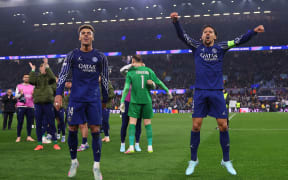 Paris Saint-Germain players Desire Doue (L) and Marquinhos celebrate after their Champions League quarter-final second-leg match against Aston Villa.