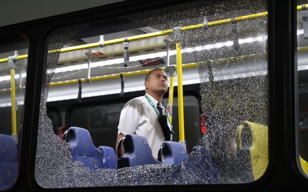 Damage to an Olympic media bus hit while driving on the transolympica highway.