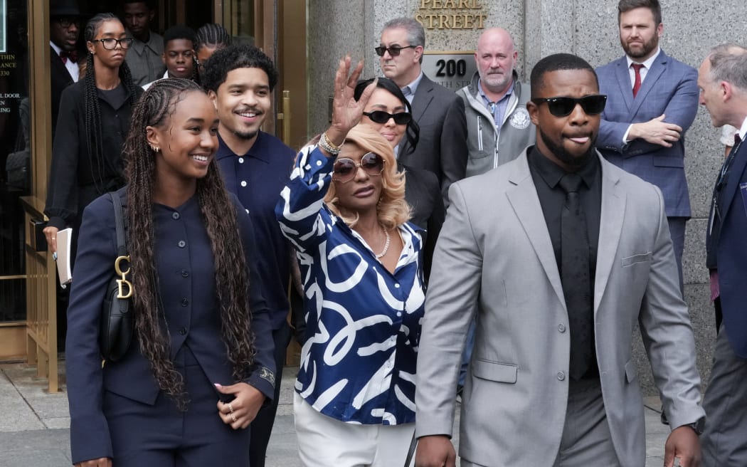 Janice Combs, centre mother of Sean "Diddy" Combs, waves as she departs alongside her grandchildren and family members at Manhattan's Federal Court after the verdict was announced in Sean "Diddy" Combs' sex trafficking trial on 2 July, 2025, in New York City.
