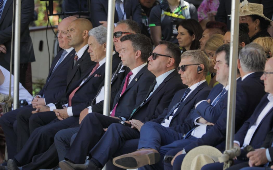 Members of the coalition government listen to speeches at the Treaty Grounds 5 February