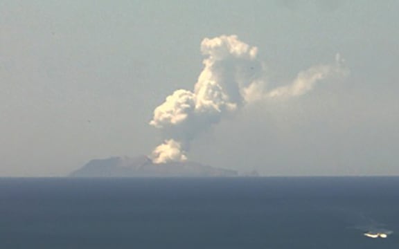 This handout image from a webcam belonging to the Institute of Geological and Nuclear Sciences shows the volcano on New Zealand's White Island spewing steam and ash on December 9, 2019. -