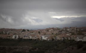 Storm clouds hang over the city as people continue to be effected by a massive natural-gas leak in the Porter Ranch neighborhood of the of the San Fernando Valley region of Los Angeles. California, December 22, 2015.