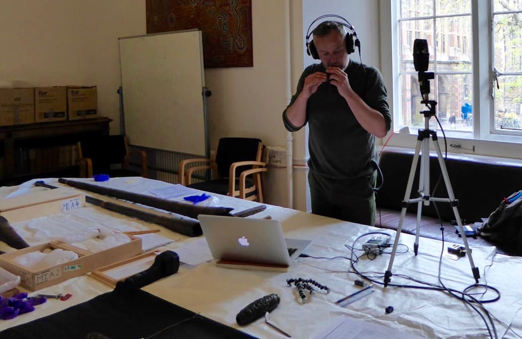 Alistair Fraser playing the tango pūoro collection at CambridgeUniversity Museum of Archaeology and Anthropology.