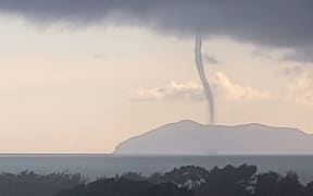 A water spout off the Bay of Plenty coast near Waihi where a tornado hit just before 10am on Saturday.
