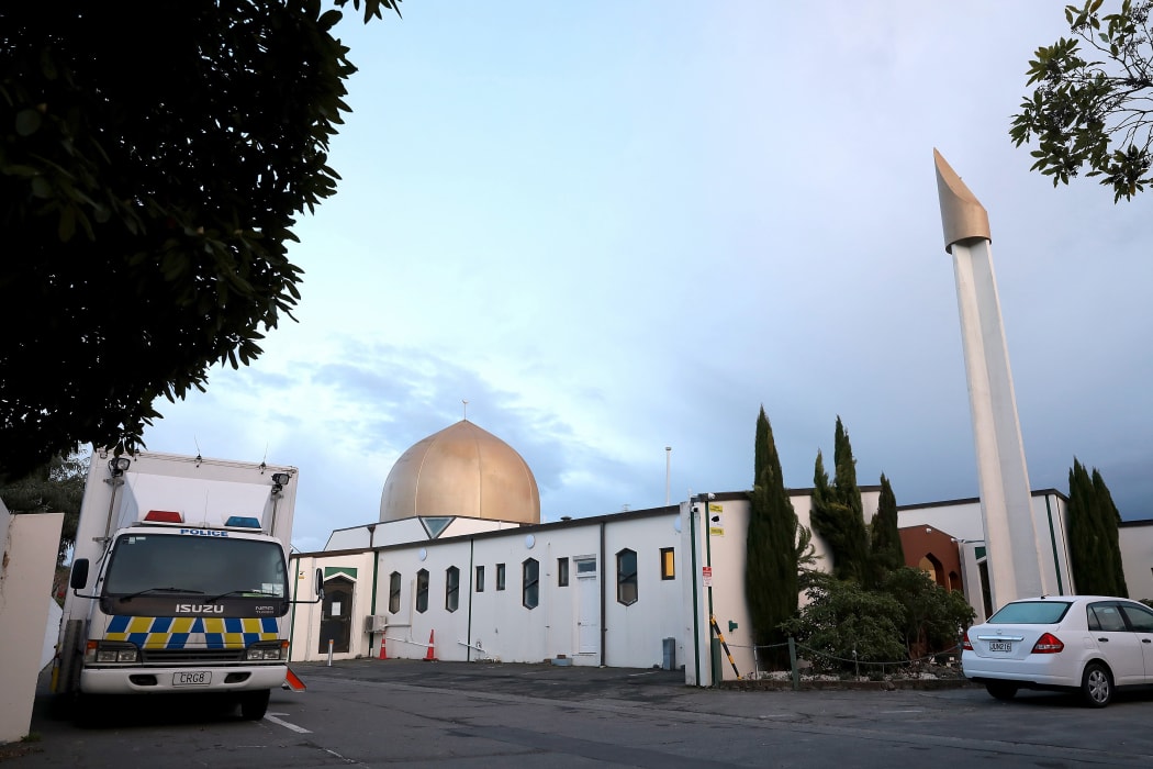 A police vehicle (L) is seen parked by the Al-Noor Mosque ahead of the last day of the sentencing hearing for Brenton Tarrant, the gunman who massacred 51 people during last year's twin mosque attacks, in Christchurch on August 27, 2020.