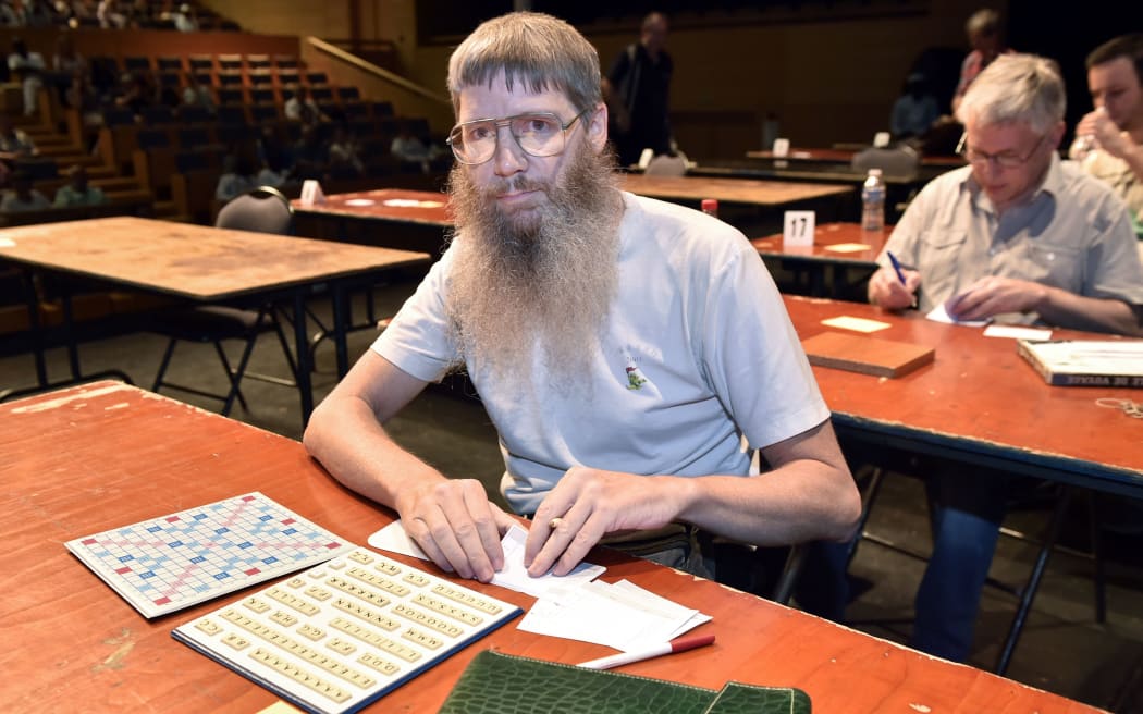 New Zealand's Nigel Richards competes in a category of the Francophone Scrabble World Championships in Louvain-La-Neuve July 21, 2015. Richards won on July 20, doesn't speak French. Richards already a celebrity in English Scrabble, winning world championships 2007 & 2011. AFP PHOTO