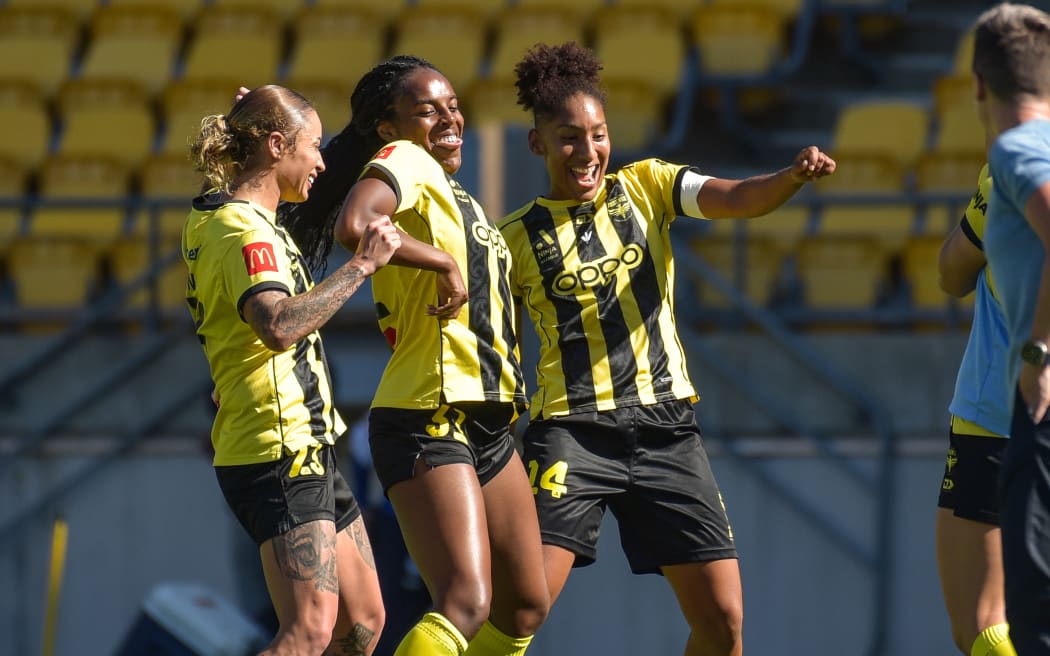 Makala Woods of Wellington Phoenix celebrates her goal with Brooke Nunn and Lucia de Leon.