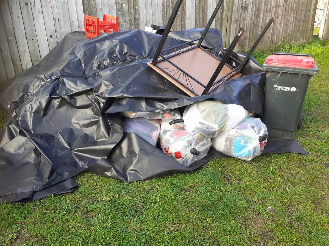 Some of the family's possessions dumped in their front yard.