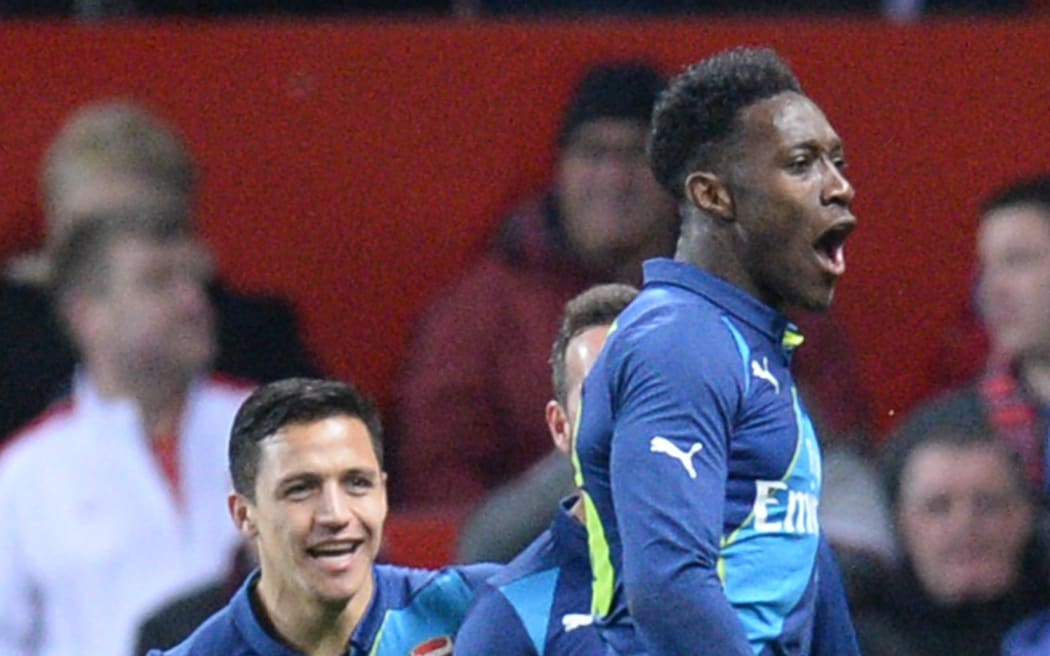 Danny Welbeck celebrates scoring a goal at Old Trafford.