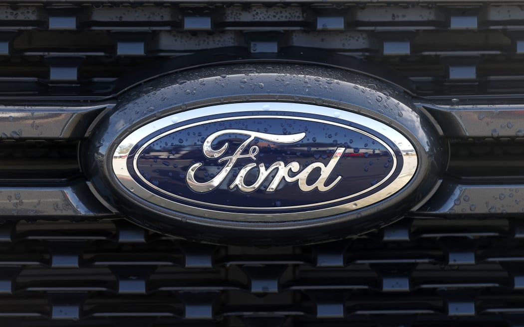 COLMA, CALIFORNIA - JANUARY 06: The Ford logo is visible on a pickup truck displayed on the sales lot at Serramonte Ford on January 06, 2026 in Colma, California. Ford Motor reported a 6 percent increase in 2025 sales, the company's best annual sales since 2019. The automaker reported sales of 2.2 million vehicles in 2025, including an 8.3 percent surge in sales of the popular F-150 pickup truck.   Justin Sullivan/Getty Images/AFP (Photo by JUSTIN SULLIVAN / GETTY IMAGES NORTH AMERICA / Getty Images via AFP)