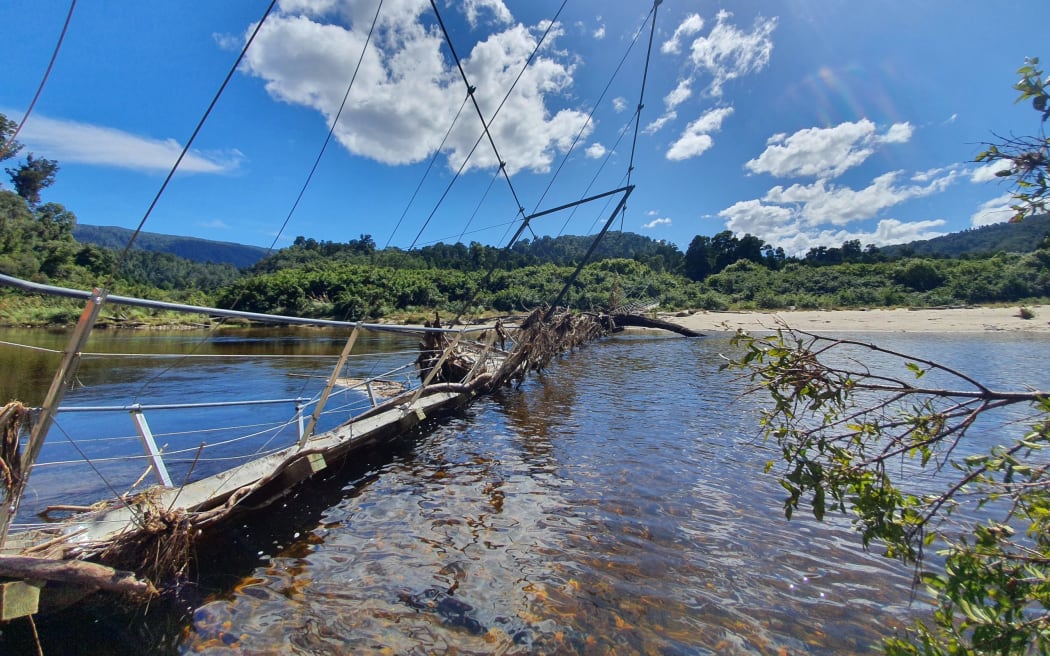 The wrecked Heaphy River Bridge on the Heaphy Track following Cyclone Dovi in February 2022.