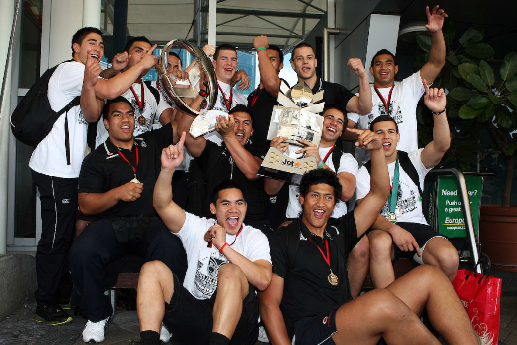 Junior Warriors arrive home with the Toyota Cup trophy and the Club Championship trophy in 2010.