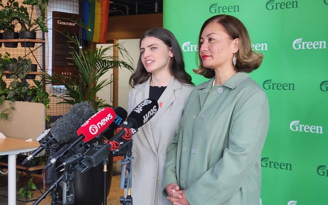 Green party co-leaders Chloe Swarbrick (left) and Marama Davidson speak to media at their annual "State of the Planet" speech at Wynyard Quarter in Auckland.