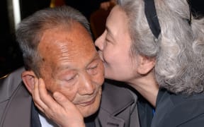 South Korean Lee Jeong-Suk, right, 68, kisses her North Korean father Ri Heung-Jong, left, 88, during a separated family reunion meeting.