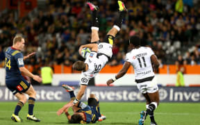 Sharks fullback Willie Le Roux and the Highlanders' Jason Emery clash, Dunedin, Friday, April 22, 2016. Photo: Dianne Manson / www.photosport.nz