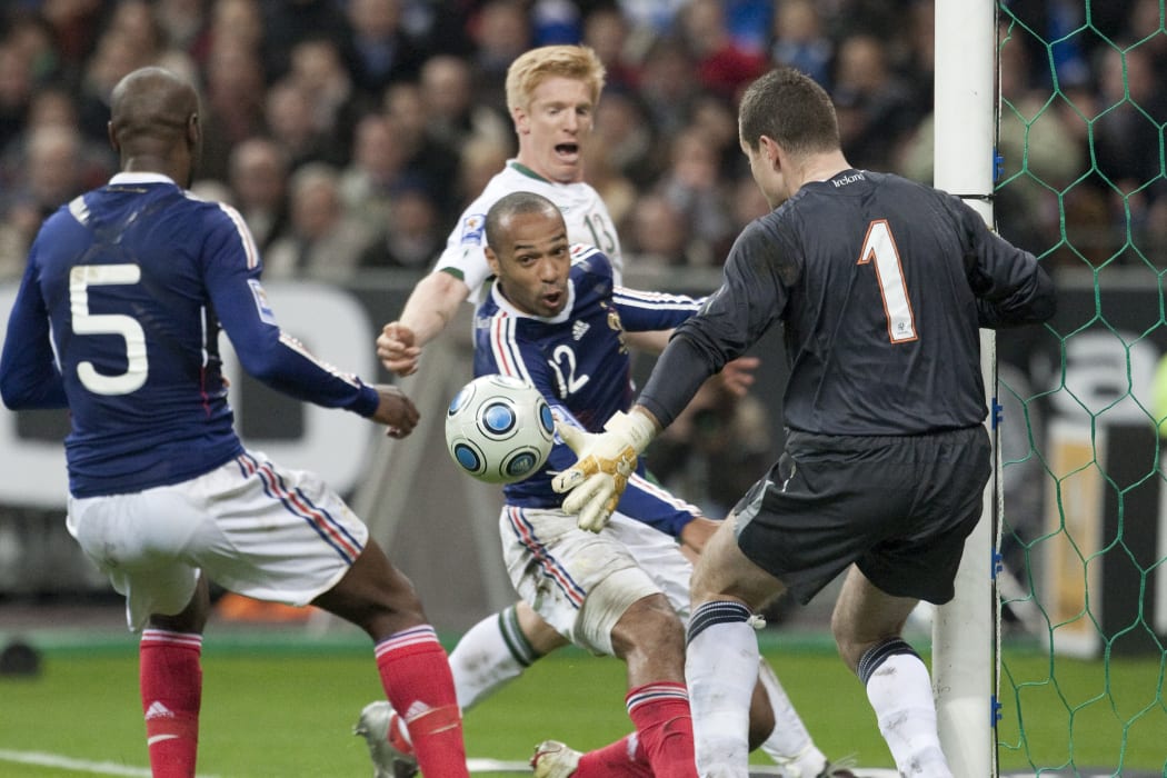 The French footballer Thierry Henry controls the ball with his hand against Ireland.
