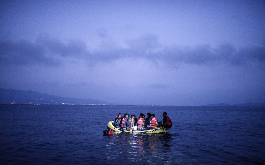 Migrants board a boat to the Greek island of Ko off the shore of Bodrum, southwest Turkey.