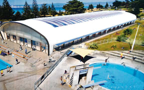 The new facility will include indoor pools, two outdoor pools, a water play area, and a new hydroslide.