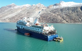 The cruise ship Ocean Explorer, operated by Australian company Aurora Expeditions, has been stuck in Alpefjord off Greenland's remote east coast since it ran aground on 11 September, 2023.