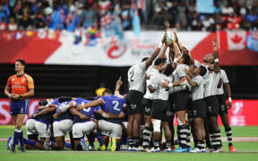 Fiji and Samoa pray before their pool clash in Vancouver.