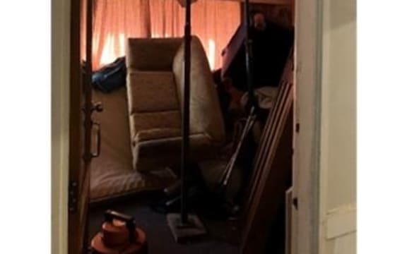 Living room in a Lyttleton boarding house.