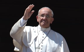 Pope Francis delivers the Urbi et Orbi blessing from the balcony of St Peter's.