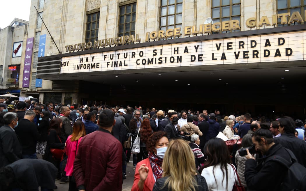 BOGOTA, COLOMBIA - JUNE 28: Hundreds of people attend the delivery of the final report of the Truth Commission at the Jorge Eliecer Gaitan Theater in Bogota, Colombia, on June 28, 2022. The commission is a body in charge of discovering and reveal past wrongdoing by a government, hoping to resolve conflicts left in the past. According to the president of the commission, Father Francisco de Roux, it is a document with "inconvenient truths" and a message to stop the conflict. Juan David Moreno Gallego / Anadolu Agency (Photo by Juan David Moreno Gallego / ANADOLU AGENCY / Anadolu Agency via AFP)