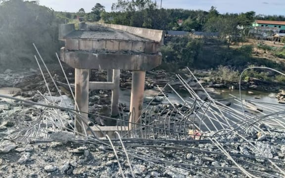 This handout photo taken and released by Agence Kampuchea Press (AKP) on December 13, 2025 shows a damaged bridge after Thai military strikes in Pursat province, amid clashes along the Cambodia-Thailand border. Violence between the Southeast Asian neighbours, which stems from a long-running dispute over the colonial-era demarcation of their 800-kilometre (500-mile) border, has displaced around half a million people on both sides. (Photo by AKP / Agence Kampuchea Press (AKP) / AFP) / RESTRICTED TO EDITORIAL USE - MANDATORY CREDIT "AFP PHOTO / AGENCE KAMPUCHEA PRESS (AKP) " - HANDOUT - NO MARKETING NO ADVERTISING CAMPAIGNS - DISTRIBUTED AS A SERVICE TO CLIENTS