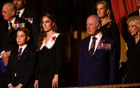 (L-R) Britain's Prince George of Wales, Britain's Catherine, Princess of Wales, Britain's King Charles III and Britain's Queen Camilla attend The Royal British Legion Festival of Remembrance event at the Royal Albert Hall, in London, on November 8, 2025 ahead of Remembrance Day commemorations. (Photo by Jack Taylor / POOL / AFP)