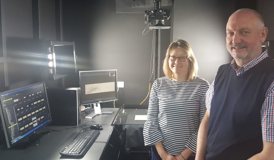 Rebekah Rogers and Gavin Mitchell from New Zealand Micrographic Services with the specially designed set-up for scanning the LINZ field notebooks.