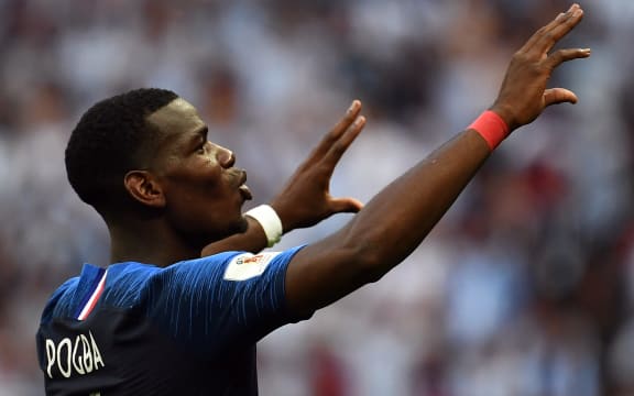 France's midfielder Paul Pogba celebrates France's victory at the end of the Russia 2018 World Cup round of 16 football match between France and Argentina at the Kazan Arena in Kazan on June 30, 2018.