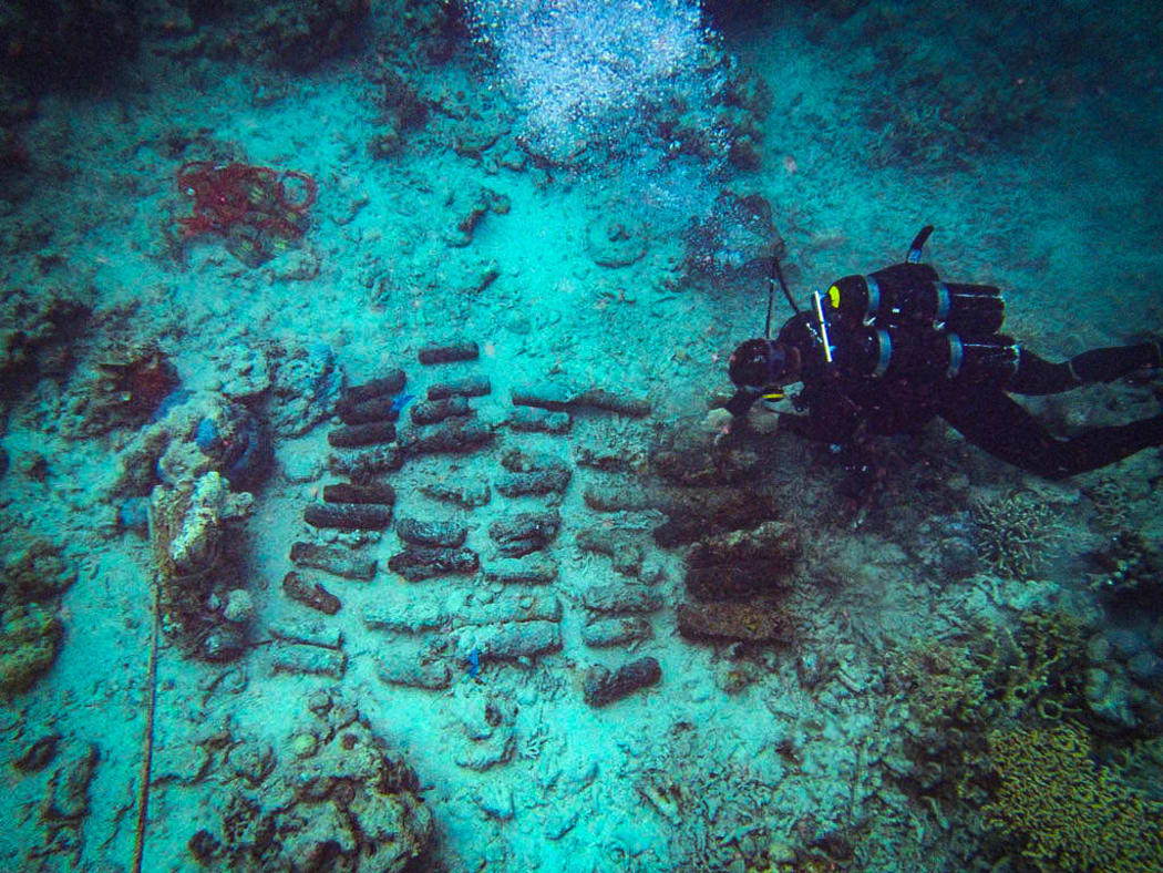 A Navy diver recovers unexploded ordnance in Solomons Islands.