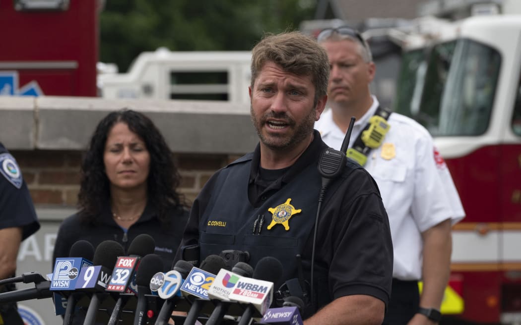 Lake County sergeant Christopher Covelli speaks at the scene of the Fourth of July parade shooting in Highland Park, Illinois on 4 July 2022.