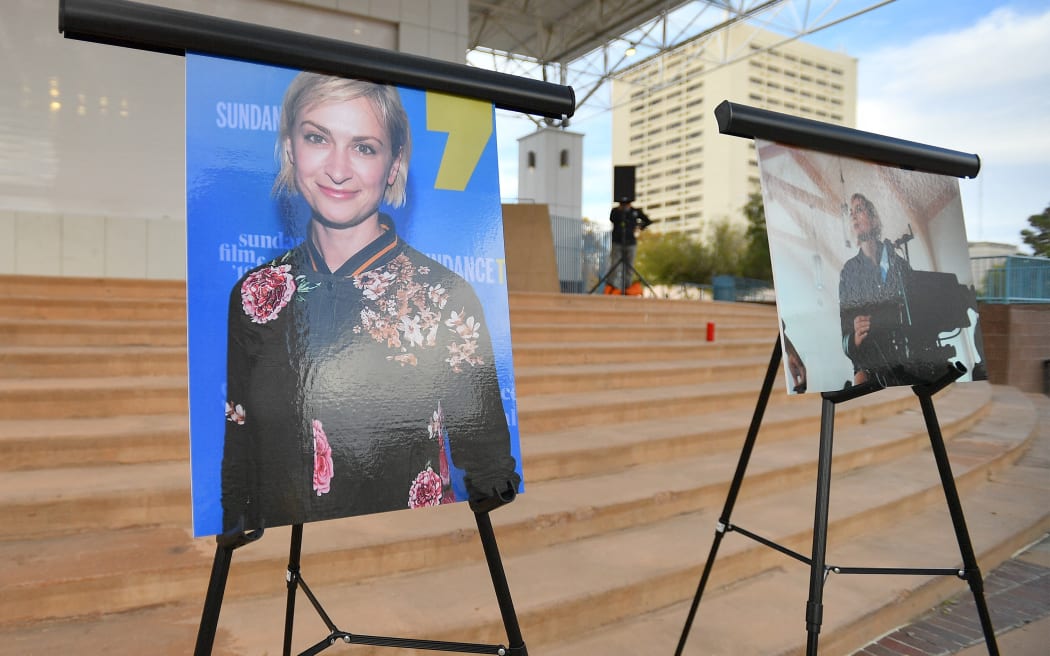 ALBUQUERQUE, NEW MEXICO - OCTOBER 23: Photos of cinematographer Halyna Hutchins are displayed before a vigil held to honor her at Albuquerque Civic Plaza on October 23, 2021 in Albuquerque, New Mexico. Hutchins was killed on set while filming the movie "Rust" at Bonanza Creek Ranch near Santa Fe, New Mexico on October 21, 2021. The film's star and producer Alec Baldwin discharged a prop firearm that hit Hutchins and director Joel Souza.   Sam Wasson/Getty Images/AFP (Photo by Sam Wasson / GETTY IMAGES NORTH AMERICA / Getty Images via AFP)