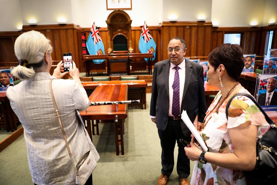 National MP Harete Hipango takes a photo of Fiji Parliament's Speaker's chair as Labour MP Adrian Rurawhe and National MP Jo Hayes standby