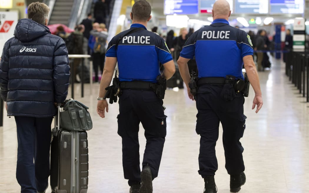 Security forces patrol Geneva airport on December 10, 2015, after police raised the alert level and searched for suspected jihadists.