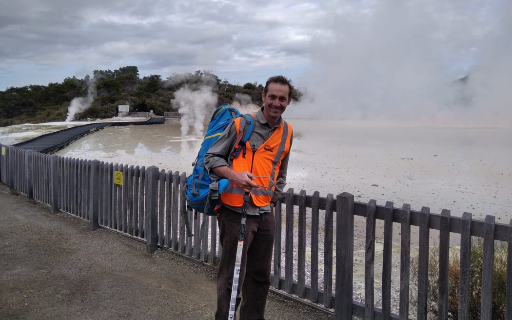 Microbiology lecturer Professor Matthew Stott researching microorganisms at Champagne Pool, Waiotapu, near Rotorua.