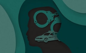 Cut paper silhouette of person, hand cuffs and police car