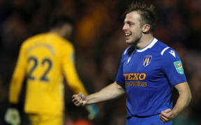 Colchester United midfielder Tom Lapslie celebrates scoring his goal in the penalty shoot-out win over Tottenham.