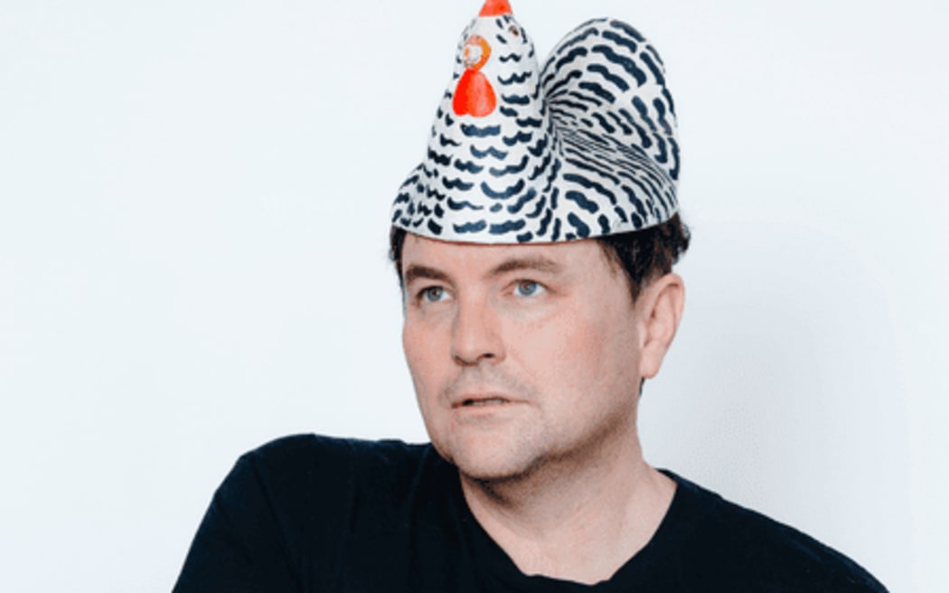Tom Sainsbury with chicken hat on head.