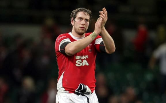 A dissapointed Wales captain Ryan Jones applauds the fans in 2008.