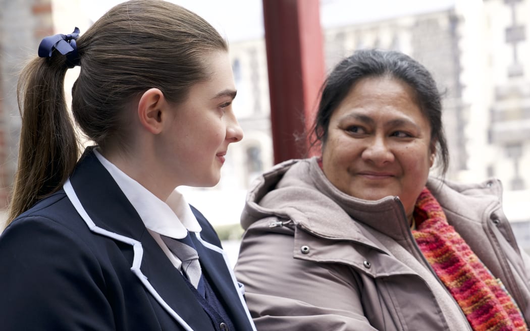 Sophie (Antonia Robertson) exchanges a look with her choir teacher Mareta (Anapela Polataivao)