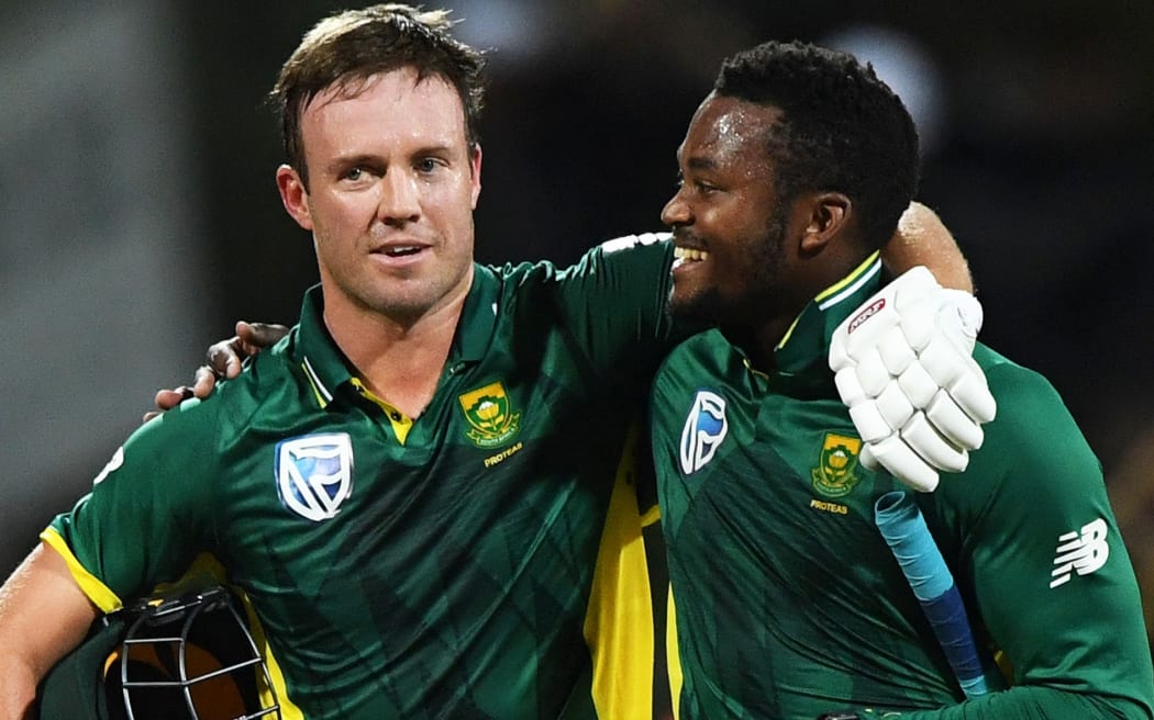 AB de Villiers hugs Andile Phehlukwayo as they win the match.