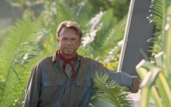 Actor Sam Neill as Dr. Alan Grant, standing next to an electric fence in a scene from the film ‘Jurassic Park’, 1993.  (Photo by Murray Close/Getty Images)