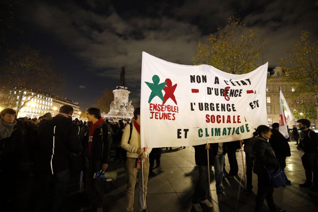 A protest in Paris on 26 November against the ban on public gatherings introduced after the attacks in the city. The banner reads "No to the state of emergency", "The emergency concerns social and climate issues".