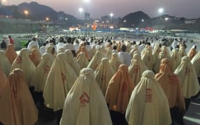 Prospective pilgrims walk to stone the devil during the first day of Eid Al Adha in Mecca.