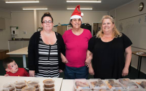 Olivia Stonyer, middle, with Happiness Inn volunteers Karina Grime and Sandra Budden.