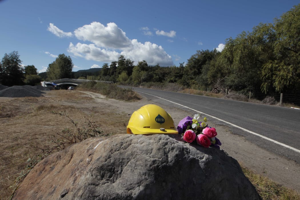 Flowers and a hard hat have been placed near the site where Mr Taiaroa was killed.